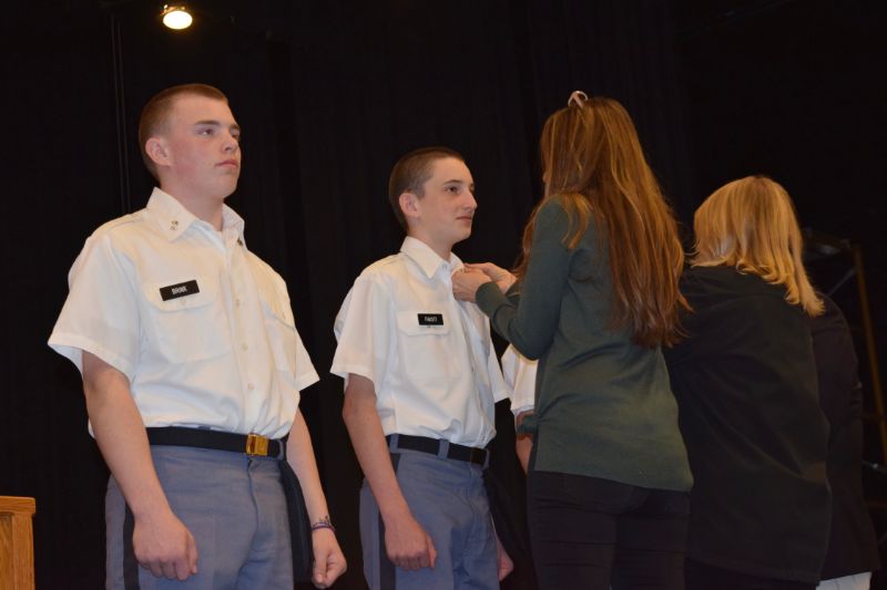 two cadets getting their pins