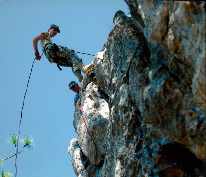 cadet repelling down rocks