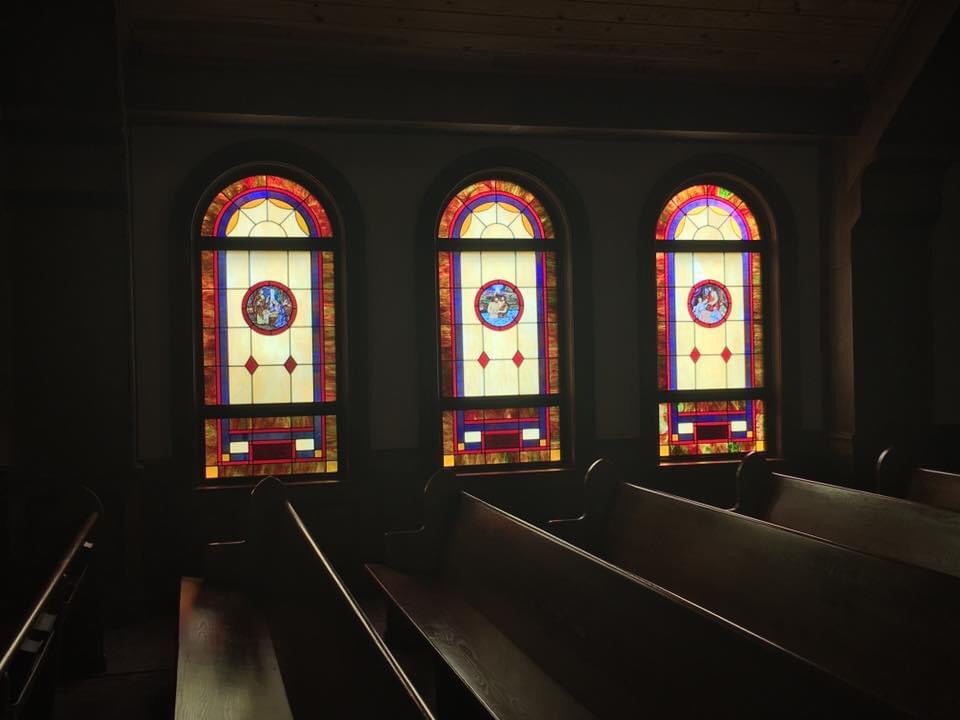 chapel stained glassed windows at sunset
